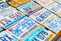 Old discontinued car license plates or vehicle registration numbers from different USA states such as California Royalty Free Stock Photo