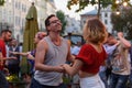 Lviv, Ukraine - June 9, 2018: Salsa dancers in outdoor cafe near Diana fountain at Market square in Lviv