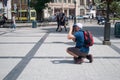 Lviv, Ukraine: Male photographer makes a photo for tourists on the streets