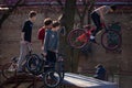 Lviv, Ukraine - March 12, 2020: BMX in the city skatepark. A group of teens on Bmx bikes in a skate park. Extreme sports Royalty Free Stock Photo