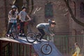 Lviv, Ukraine - March 12, 2020: BMX in the city skatepark. A group of teens on Bmx bikes in a skate park. Extreme sports Royalty Free Stock Photo