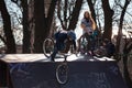 Lviv, Ukraine - March 12, 2020: BMX in the city skatepark. A group of teens on Bmx bikes in a skate park. Extreme sports Royalty Free Stock Photo