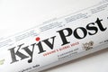 Lviv / Ukraine - March 2020: Close up view of the front page of folded Ukrainian newspaper Kyiv Post on a white desk. Reading and