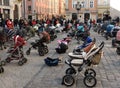 Lviv, Ukraine - March 18, 2022: 109 empty strollers are seen placed outside the Lviv city council during an action to highlight