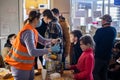 LVIV, UKRAINE - March 12, 2022: Humanitarian crisis during the war in Ukraine. Volunteers helping to feed thousands of refugees