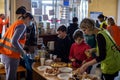 LVIV, UKRAINE - March 12, 2022: Humanitarian crisis during the war in Ukraine. Volunteers helping to feed thousands of refugees