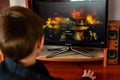 LVIV, UKRAINE - MARCH 08, 2019: Illustration of a computer game World of Tanks, showing a teenager playing this game