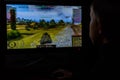 LVIV, UKRAINE - MARCH 08, 2019: Illustration of a computer game World of Tanks, showing a teenager playing this game