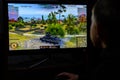 LVIV, UKRAINE - MARCH 08, 2019: Illustration of a computer game World of Tanks, showing a teenager playing this game