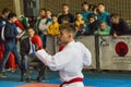 Unknown junior karate player preparing to strike