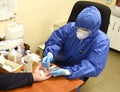 Lviv, Ukraine - March 31, 2020: A medical worker makes a rapid test for coronavirus COVID-19 of a bus driver in Lviv, Ukraine