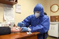 Lviv, Ukraine - March 31, 2020: A medical worker makes a rapid test for coronavirus COVID-19 of a bus driver in Lviv, Ukraine