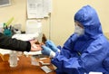 Lviv, Ukraine - March 31, 2020: A medical worker makes a rapid test for coronavirus COVID-19 of a bus driver in Lviv, Ukraine