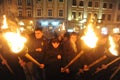 Members of the nationalist organizations hold torches as they take part in a rally marking the 70th death anniversary of Roman Shu