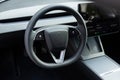 Lviv, Ukraine - March 23, 2024: Tesla Model 3 highland electric car steering wheel. Leather dashboard, climate control Royalty Free Stock Photo
