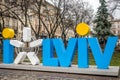 LVIV, UKRAINE - MARCH 2016: Tourist love symbol of the city of Lviv in the Market Square next to City Hall, Ukraine