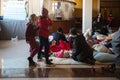 Ukrainian refugees on Lviv railway station during russian war. Refugee kids in waiting hall