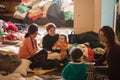 Ukrainian refugees on Lviv railway station during russian war. Refugee kids in waiting hall