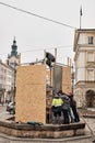 LVIV, UKRAINE - March 16, 2022: Ukrainians Work to Protect Historic Statues in Lviv