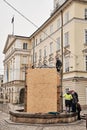 LVIV, UKRAINE - March 16, 2022: Ukrainians Work to Protect Historic Statues in Lviv