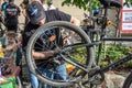 LVIV, UKRAINE - MAY 2018: The cyclist repairs his bicycle by pumping a punctured wheel Royalty Free Stock Photo