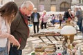 Lviv, Ukraine - May 1, 2022 : people shopping at garage sale, bying different antiques on flea market