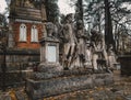 Lviv / Ukraine - November 2019: A set of sculptures at the old crypt at Lychakiv cemetery. Beautiful tonbstone statues in serene