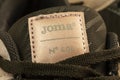 Sports shoes of the Joma brand. Logo close-up