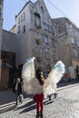 Young girl with angel wings on Lviv streets