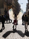 Young girl with angel wings on Lviv streets