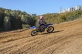 LVIV, UKRAINE - OCTOBER 2021: Athletes motorcycle children racers compete in motocross competition on the race track