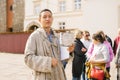 Lviv, Ukraine. A guide in a beggar costume on an animated tour in a historic city