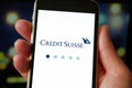 Lviv, Ukraine - 03 11 2023: Person holding mobile phone with logo of financial company Credit Suisse Group AG on screen