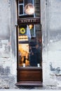 Lviv, Ukraine - September 30, 2016: Date in a cafe. Two people talking at a table in a cafe, view from the street Royalty Free Stock Photo