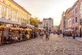 LVIV, UKRAINE - SEPTEMBER 12, 2016: Lviv City and Lviv Old Town With People. Sunset Light