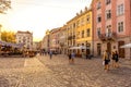 LVIV, UKRAINE - SEPTEMBER 12, 2016: Lviv City and Lviv Old Town With People. Sunset Light