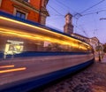 LVIV, UKRAINE - SEPTEMBER 12, 2016: Lviv City and Lviv Old Town With People. Sunset Light and Lviv City Hall With Moving Tram. Lon