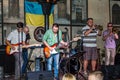 Lviv, Ukraine - September 2015: Musicians play the trumpet, guitar, piano and drums at the Lviv CafÃÂ© before the audience fans