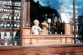 Showcase of a vintage pharmacy with potions, flasks, bottles and a puppet pharmacist, located in the city of Lviv