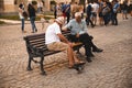 Lviv, Ukraine - September 18, 2018: two old seniors men plays chess outdoors at city bench Royalty Free Stock Photo