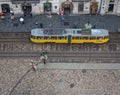 Lvov panorama landmark with yellow tram, top view. Historical center with city transportation of Lviv. Ancient buildings in Lvov.
