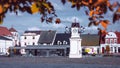 Lwowek, Wielkopolskie, Poland - the main square with a clock tower and a bus station in colorful autumn scenery. Royalty Free Stock Photo