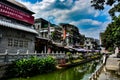 Lychee Bay in Guangzhou,Chinaunder widen sky in Litchi Bay of Guangzhou China, water flowing beneath a little bridge.