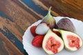 Lychee and figs on a wooden table Royalty Free Stock Photo
