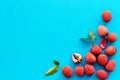 Lychee frame. Exotic asian fruits on blue background top-down copy space Royalty Free Stock Photo