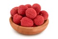lychee fruit in wooden bowl isolated on white background with full depth of field Royalty Free Stock Photo