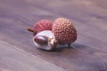 Lychee fruits on wooden background