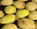 Lychee- small rounded fruit with sweet white scented flesh, a large central stone, and a thin rough skin