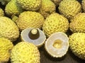 Lychee- small rounded fruit with sweet white scented flesh, a large central stone, and a thin rough skin