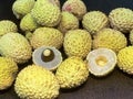 Lychee- small rounded fruit with sweet white scented flesh, a large central stone, and a thin rough skin